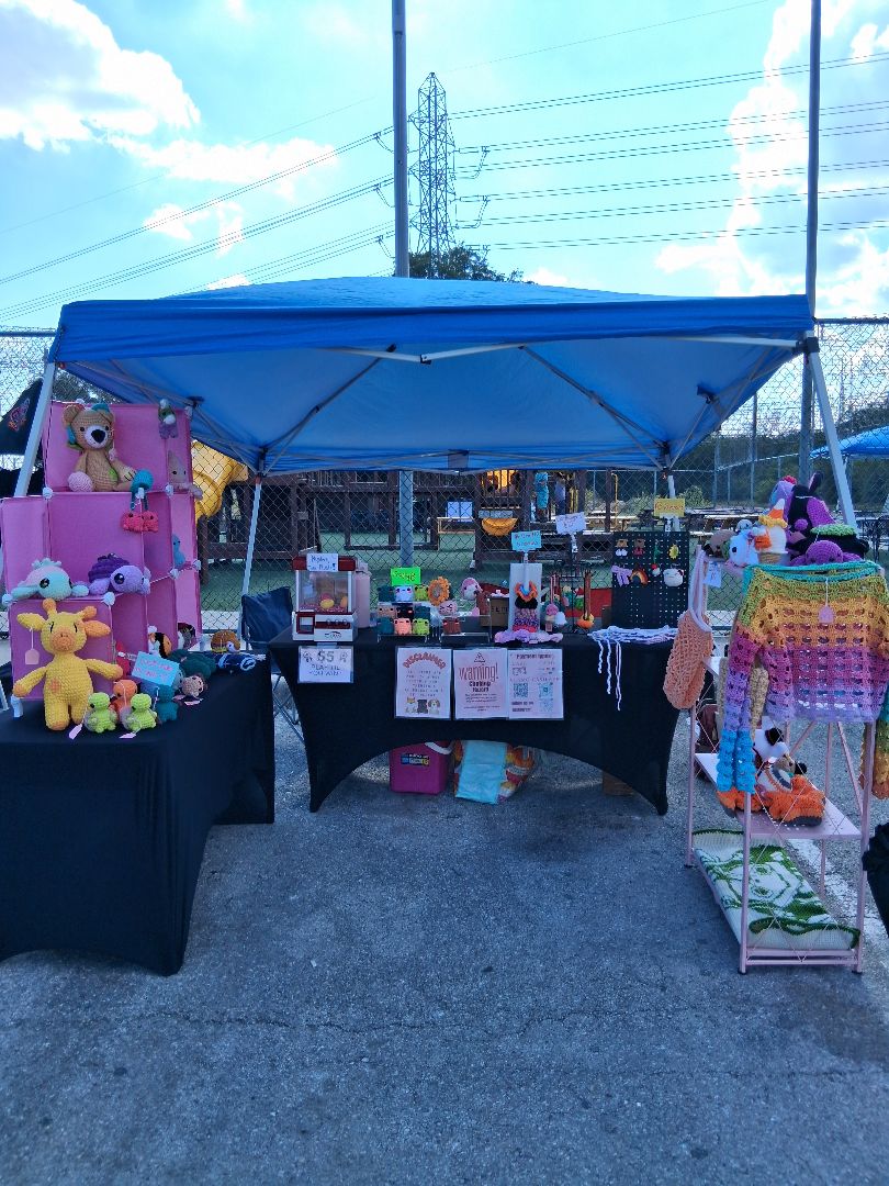 Coco Beans Creations crochet display at a local market